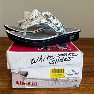 Alegria Vanessa White Snake Print Thong Sandals with Silver Buckle
